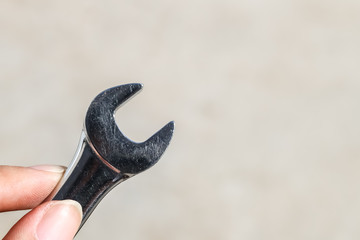 The Isolated Wrench with the Gray Ground Background