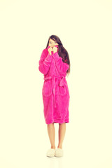Beautiful woman in pink bathrobe.
