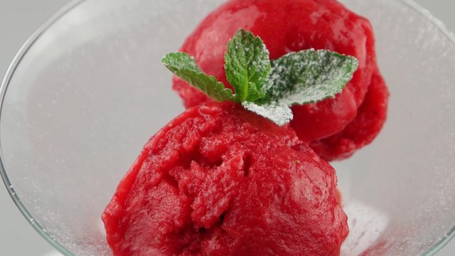 Strawberry sorbet ice cream in a glass cup
