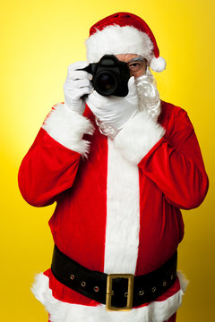 Smile please!! Santa claus clicking picture