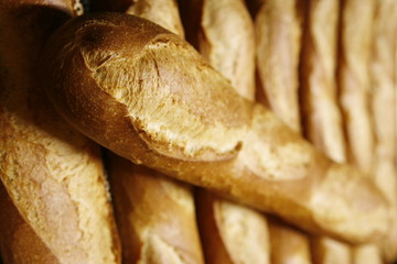 one baguette laying on other baguetts.