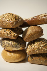 several diverse roll bun with and without seed