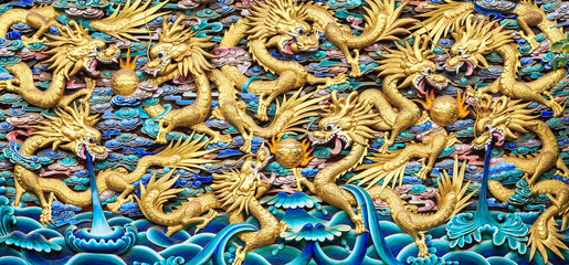 Ancient Wood Sculpture of Many Golden Dragons in Chinese Temple,