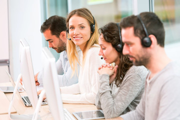 Young attractive woman working in a call center