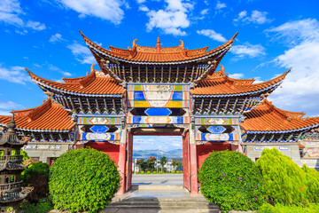 Arched  Entrance of Chinese Temple under Blue Sky and White Cloud