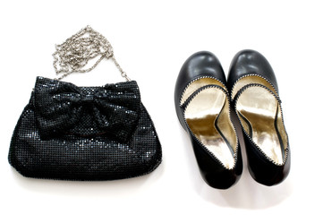 Clutch bag and shoes over white