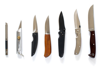 Knife set in line over white