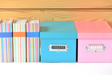 Colorful binders and boxes with blank label
