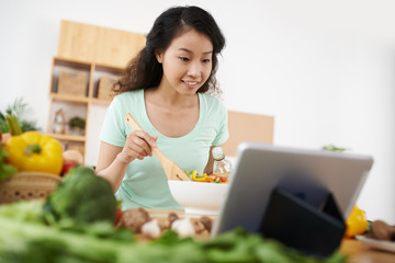 Mixing vegetable salad