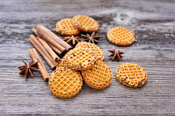 Cookies with cinnamon and star anise on a rustic wooden background