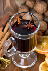 Mulled wine, cinnamon sticks, nuts and dried orange slices