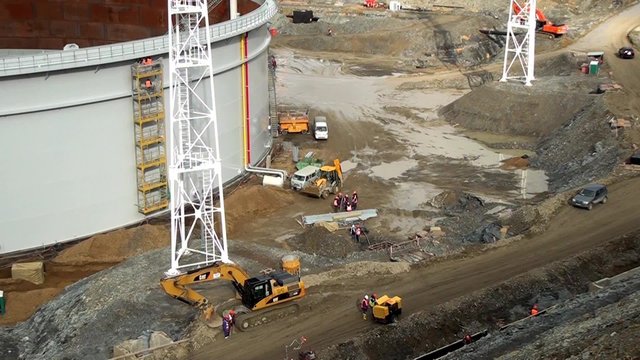 Construction of oil storage. Heavy equipment.