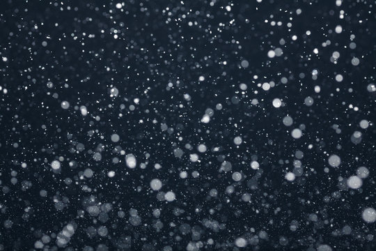 Snow Falling from Night Sky