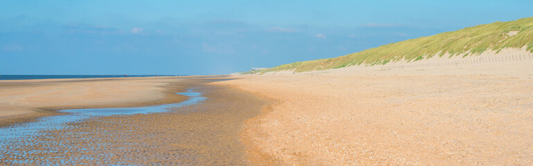 Blue sky over a beach along the North Sea