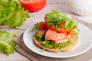 sandwich with cheese, tomato and salmon, close-up