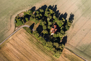 aerial view of the  church and  harvest fields