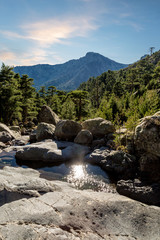 Rocks, rivers, forest and mountains viewed from GR20 trail in Co