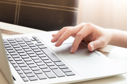 Woman's hands typing on laptop keyboard : Selective Focus