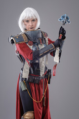 Naklejka premium Woman warrior in battle armor. Isolated on the gray background