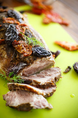 Meat baked with prunes and tomatoes
