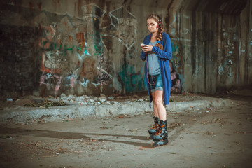 girl with roller skates on graffiti background