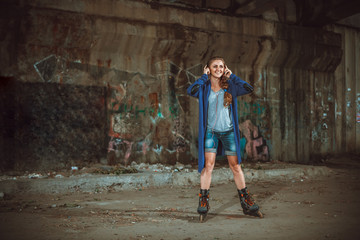 girl with roller skates on graffiti background