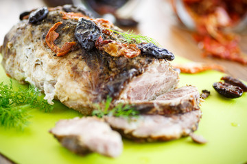 Meat baked with prunes and tomatoes