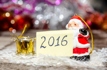 Christmas decoration. 2016 text with toy Santa Claus