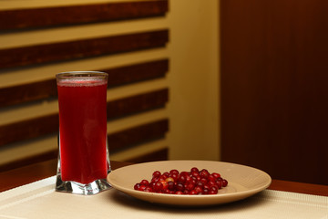 Glass of sweet mors and plate with ingredients © Mrakor