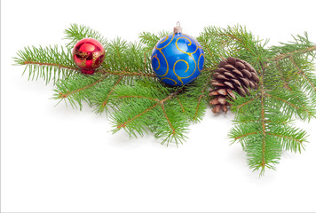 Branch of a fir tree and Christmas ornaments