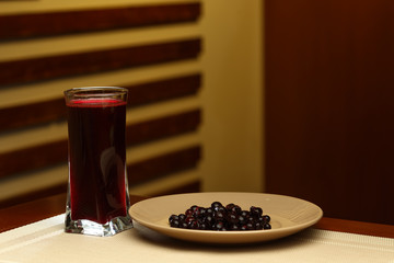 Glass of sweet mors and plate with ingredients © Mrakor