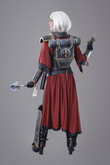 Fototapeta premium Woman warrior in battle armor. Isolated on the gray background