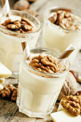 Dessert of white chocolate and walnuts, selective focus