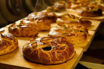Pies on wooden tray in the restaurant 