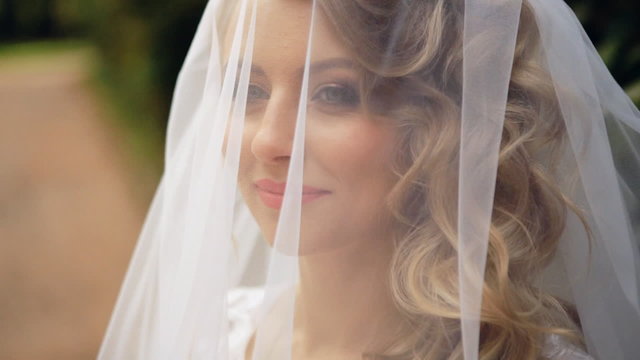Bride Wears A Veil At Face Close Up shot in slow motion  
