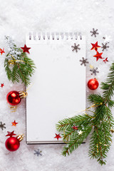 Open notebook with christmas decoration, selective focus