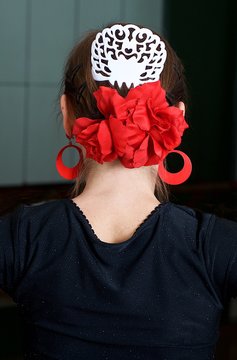 Fragment photo of flamenco dancer, spanish, head jewelry of flamenco dancer 