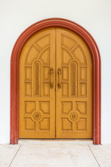 The ancient wooden door. Floral pattern on old door.