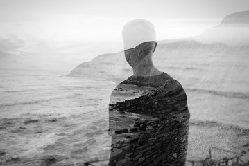 Double exposure with young man with ocean on the background