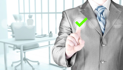 business man touching, pressing modern button with green ticking Check Box