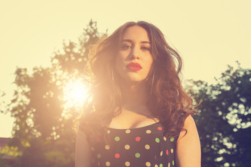 Portrait of a young girl outdoors in retro colors.