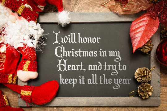 Blackboard with the text: I Will Honor Christmas in My Heart, and Try to Keep It All the Year