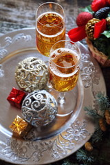 New Year's spirit: two glasses of champagne and Christmas decor