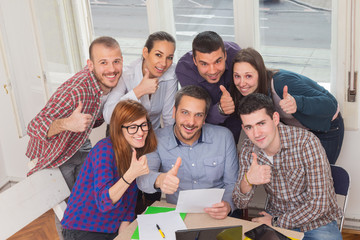 Young group of people discussing business plans.
