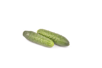 green cucumbers on white background
