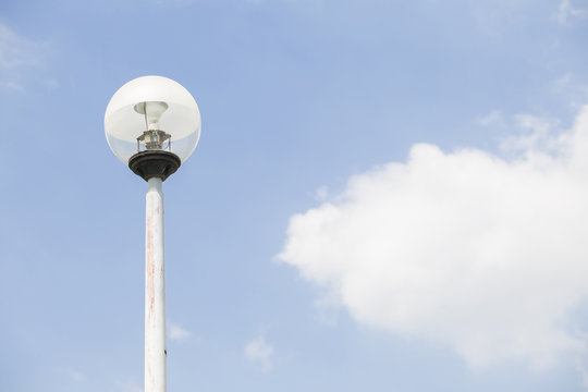 Lamppost with blue sky and cloud