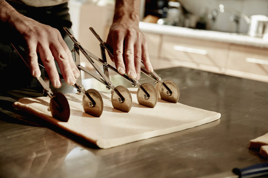 Baker using dough cutter