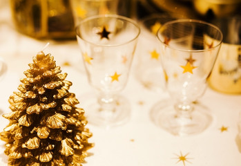 Christmastime table setting with golden festive decorations