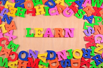Learn written by plastic colorful letters