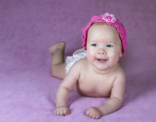 infant isolated on a pink background